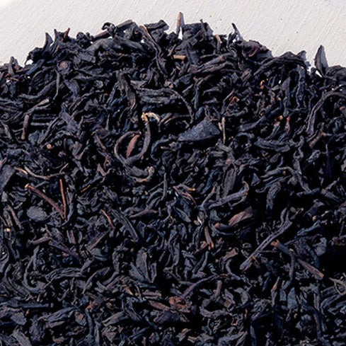 Amish Heart Loose Leaf Black Peach Tea, featuring organic black tea blended with peach flavor and calendula petals, ideal for a refreshing drink.