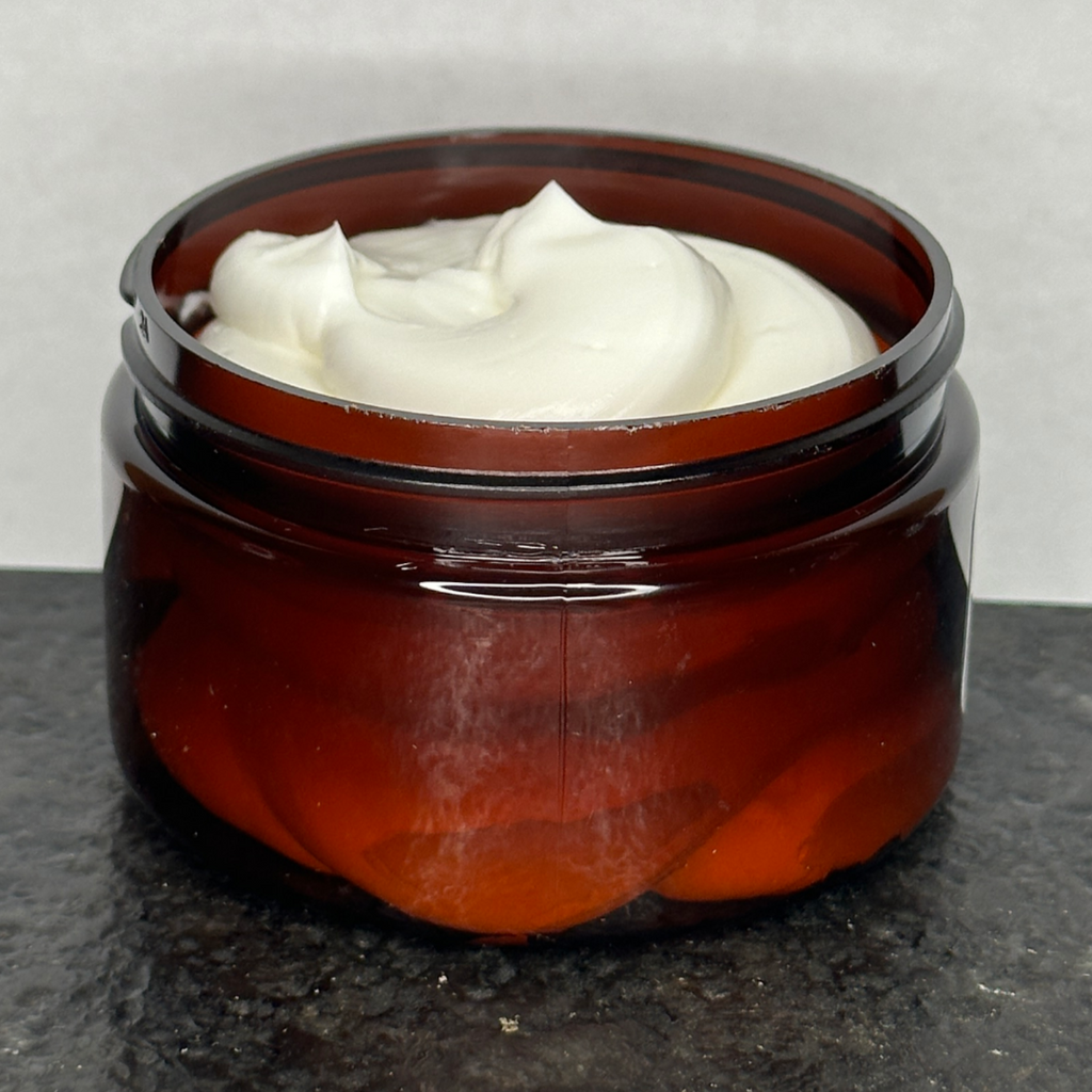 Jar of Amish Heart Cedarwood & Patchouli Body Butter, 100% organic with a silky smooth consistency, enriched with natural ingredients and essential oils.