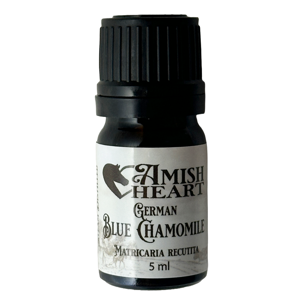 Bottle of Amish Heart German Blue Chamomile Essential Oil, showcasing its rich blue color and organic therapeutic properties for healing and relaxation.