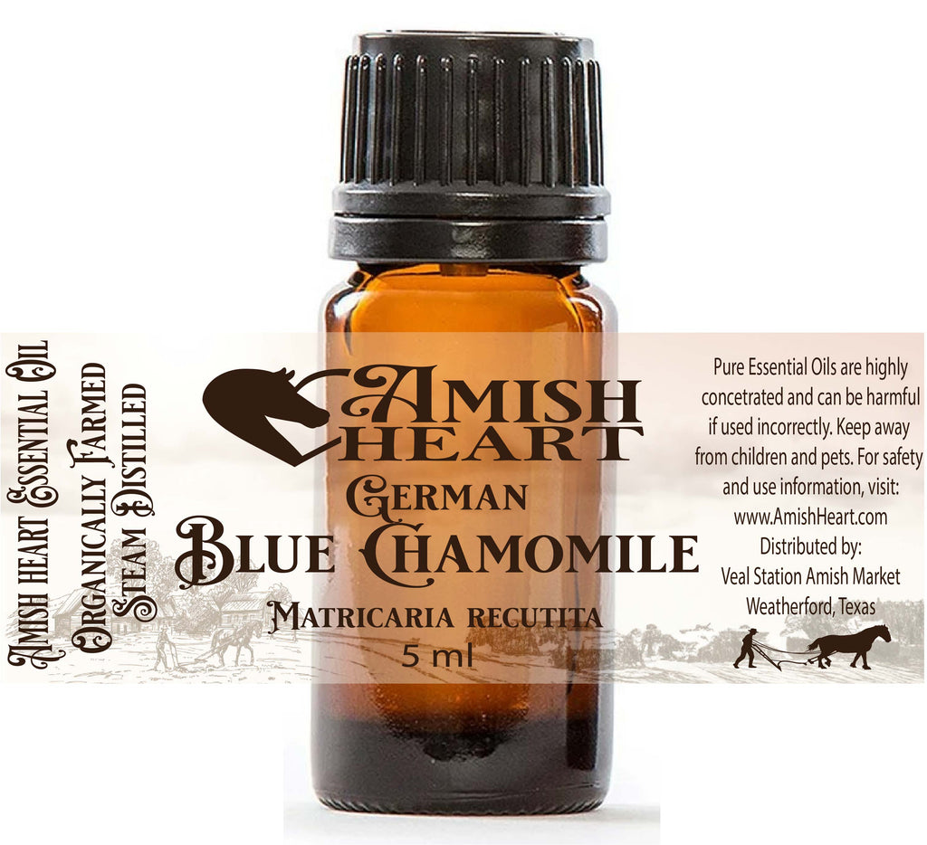 Bottle of Amish Heart German Blue Chamomile Essential Oil, showcasing its rich blue color and organic therapeutic properties for healing and relaxation.